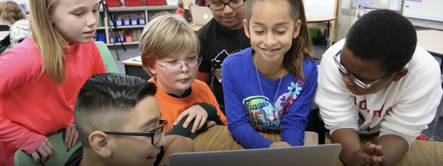 students looking at laptop